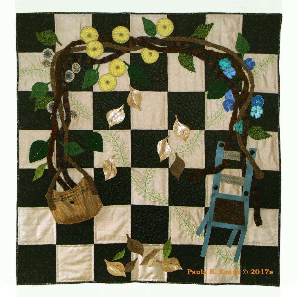 Art quilt with flowers, vines, and a chair against checkerboard background.