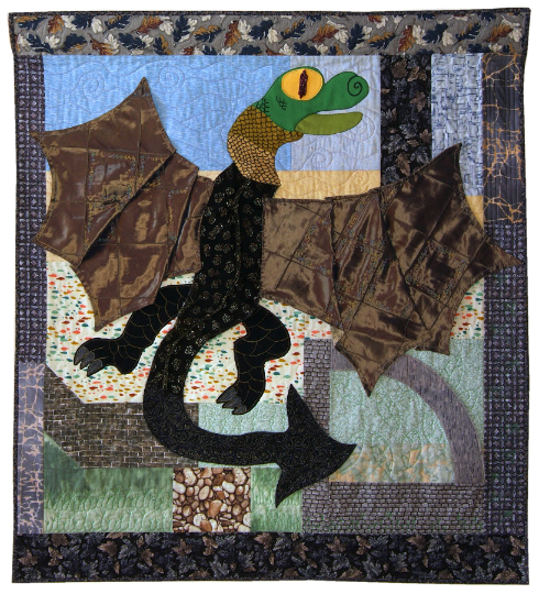 Art quilt with dragon flying over a castle.